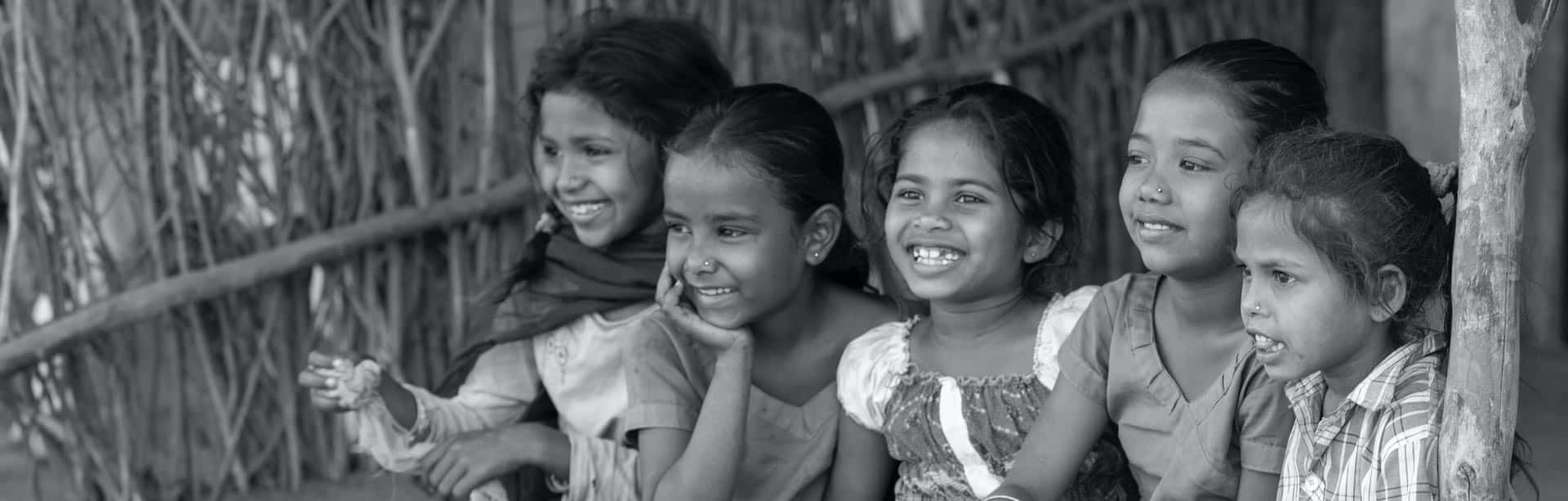 Image of children smiling as representative invite to contact us